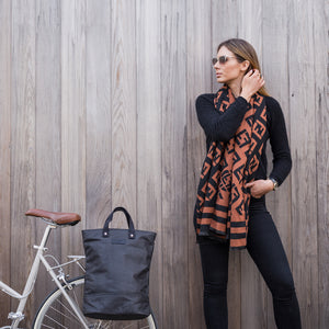 Black and copper canvas cycling bag on bicycle
