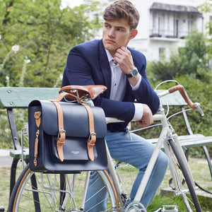 Navy and Tan leather satchel cycle bag attached to bicycle
