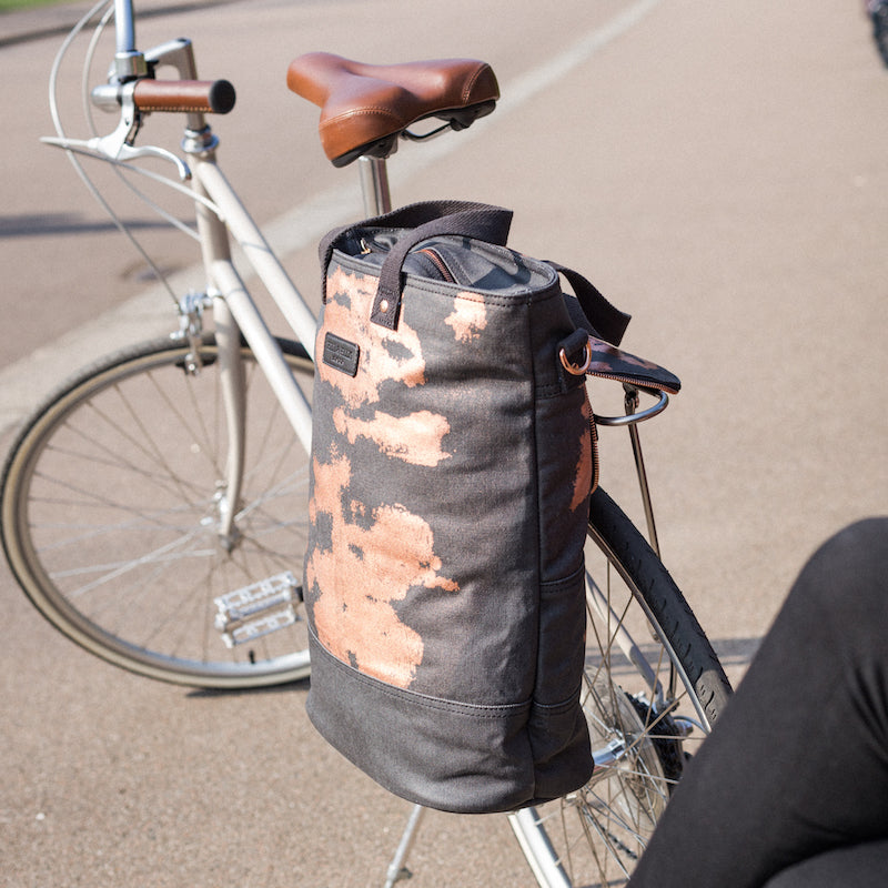Copper print canvas cycling bag attached to bike