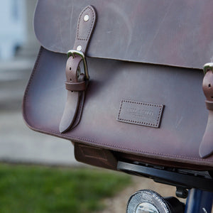 Brown leather brompton compatible cycle bag on bicycle