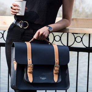 Navy and Tan leather satchel cycle bag with model