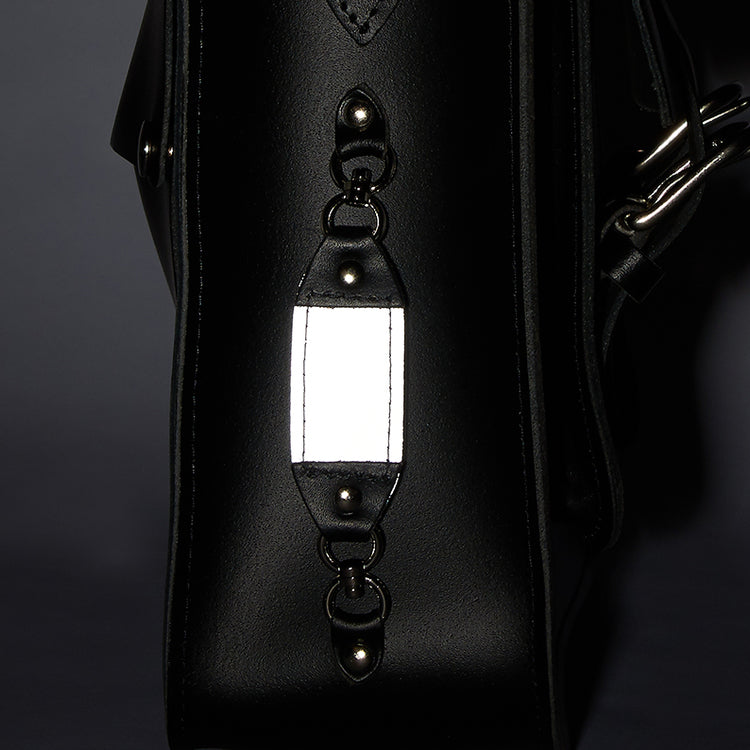 Reflective detailing on a leather bike bag