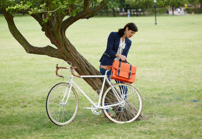Orange Satchel cycle bag on bicycle