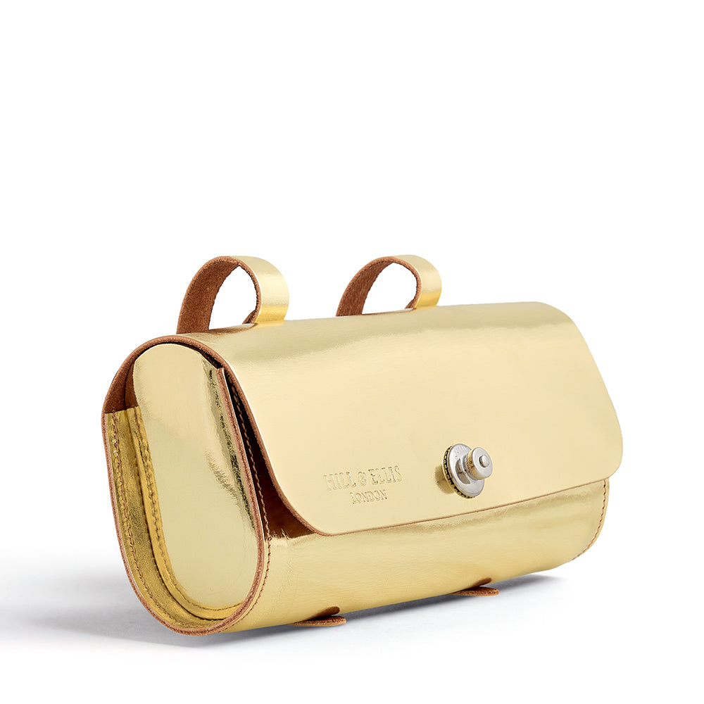
            
                Load image into Gallery viewer, Gold leather saddle bag on side
            
        