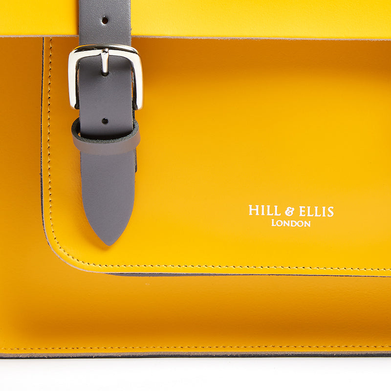 
            
                Load image into Gallery viewer, Yellow leather satchel cycle bag detail of Hill &amp;amp; Ellis embossing
            
        