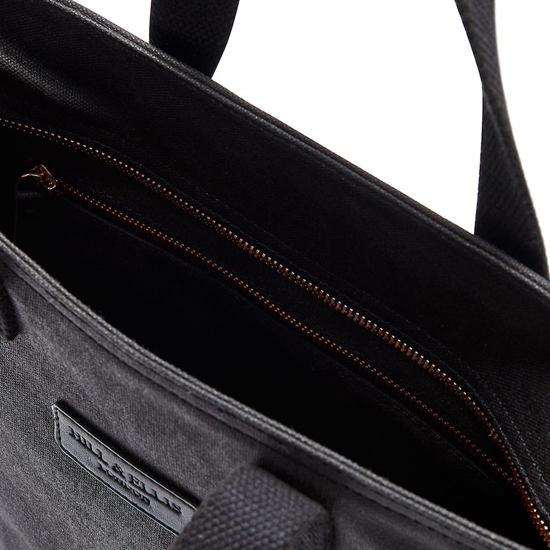 Black and copper canvas cycling bag detail of the inside
