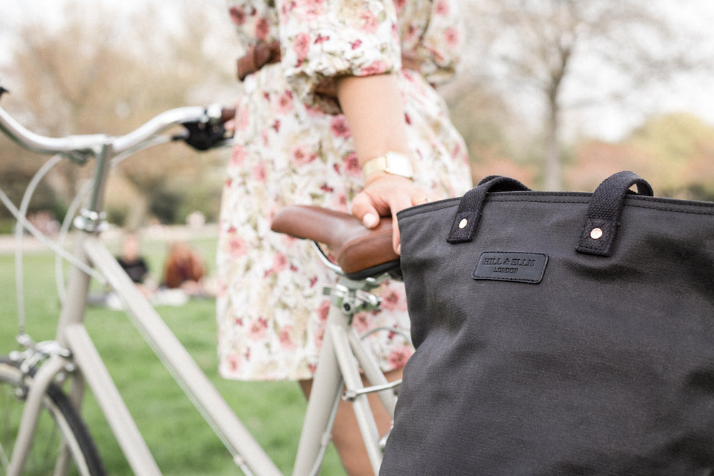 Black and copper canvas cycling bag on bike