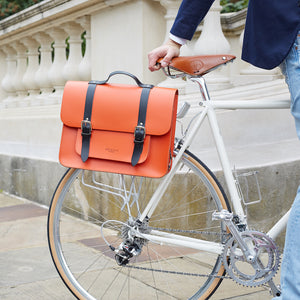 Orange leather satchel cycle bag on bicycle