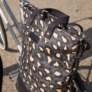 
            
                Load image into Gallery viewer, Leopard print canvas cycling bag on bicycle
            
        