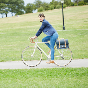 Navy and Tan leather satchel cycle bag on bicycle