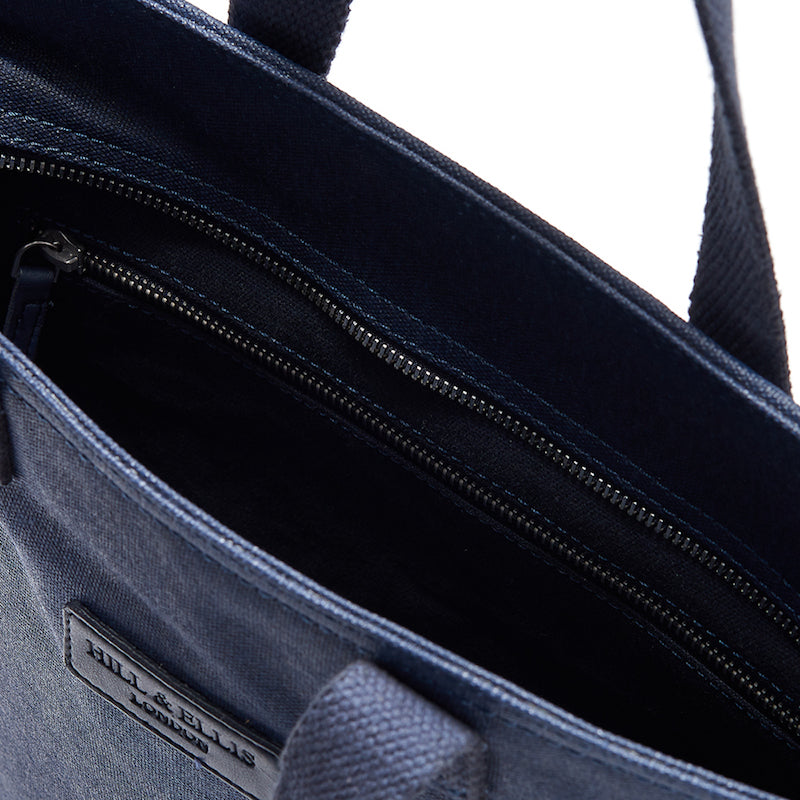 
            
                Load image into Gallery viewer, Navy canvas cycling bag inside
            
        