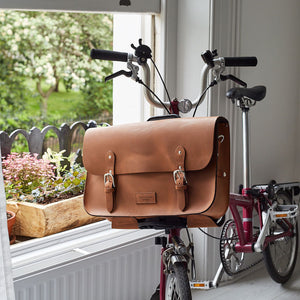 Tan leather brompton compatible cycle bag on bike