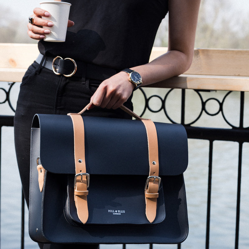 
            
                Load image into Gallery viewer, Navy and Tan leather satchel cycle bag with model
            
        